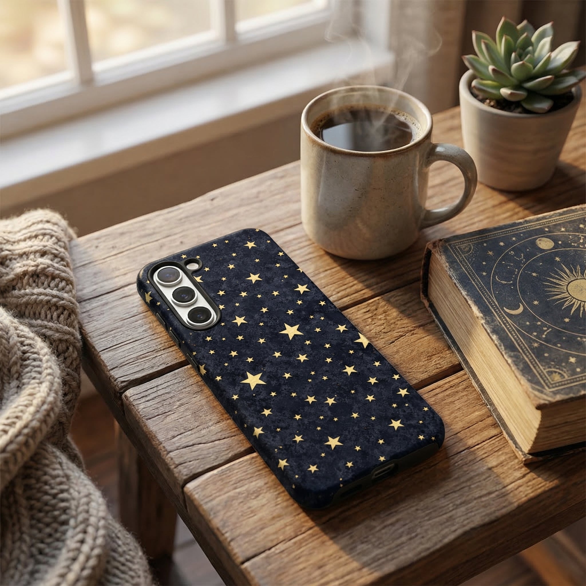 Samsung Tough Phone Case with Starry Night design by Coconut Lane, next to a mug, book, and succulent on a wooden table.