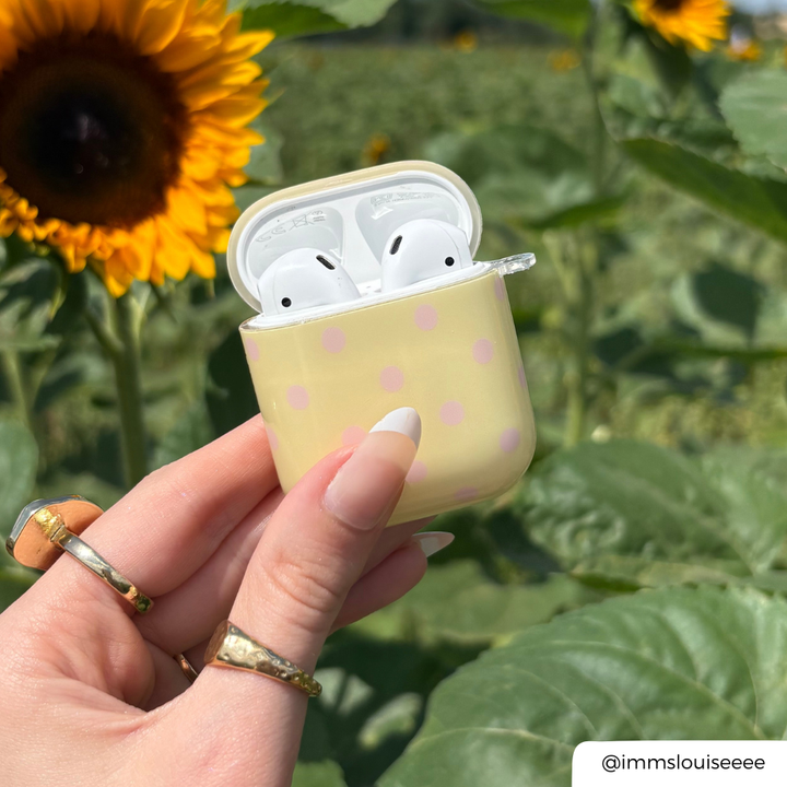 AirPods Case in Butter Blush being held by girl