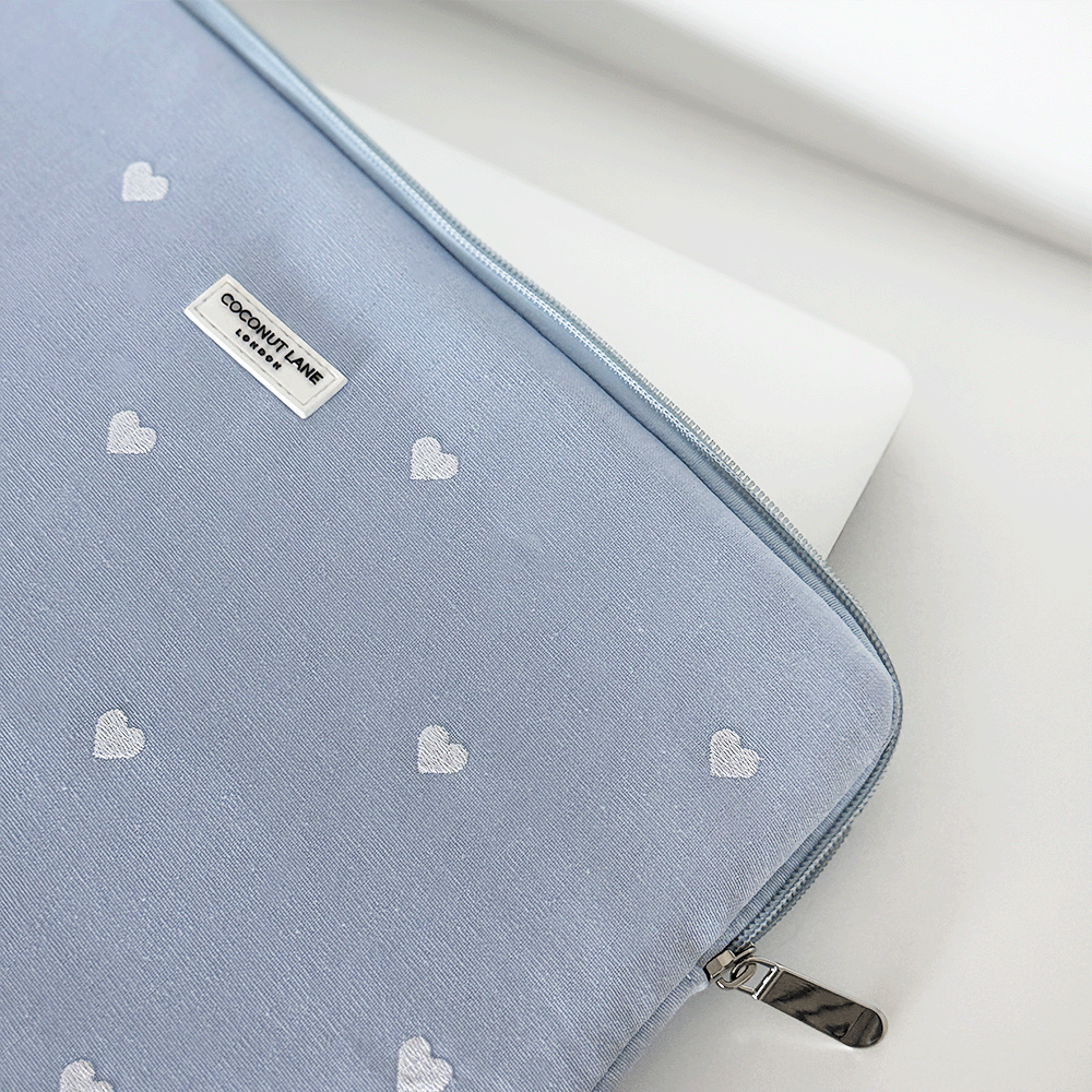 Blue fabric Laptop Sleeve with embroidered heart design.