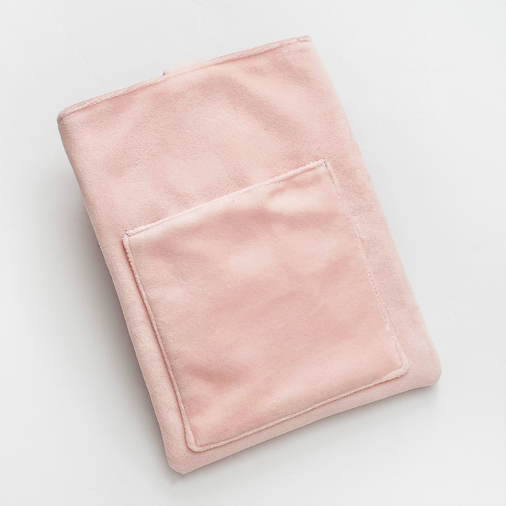 Reverse of Book Sleeve made from soft blush pink velvet with back pocket photographed on a white background.