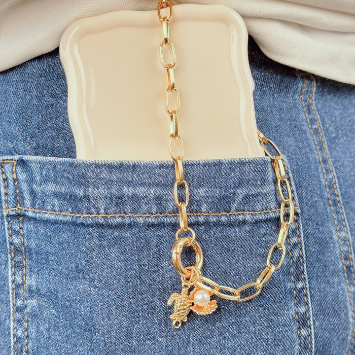 Paperclip O Ring Chain shown in blue jean pocket