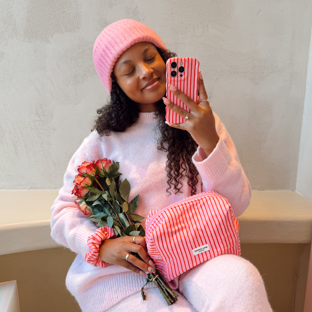 Girl sat in cafe holding flowers taking a selfie with Wavy Cherry Stripes Phone Case