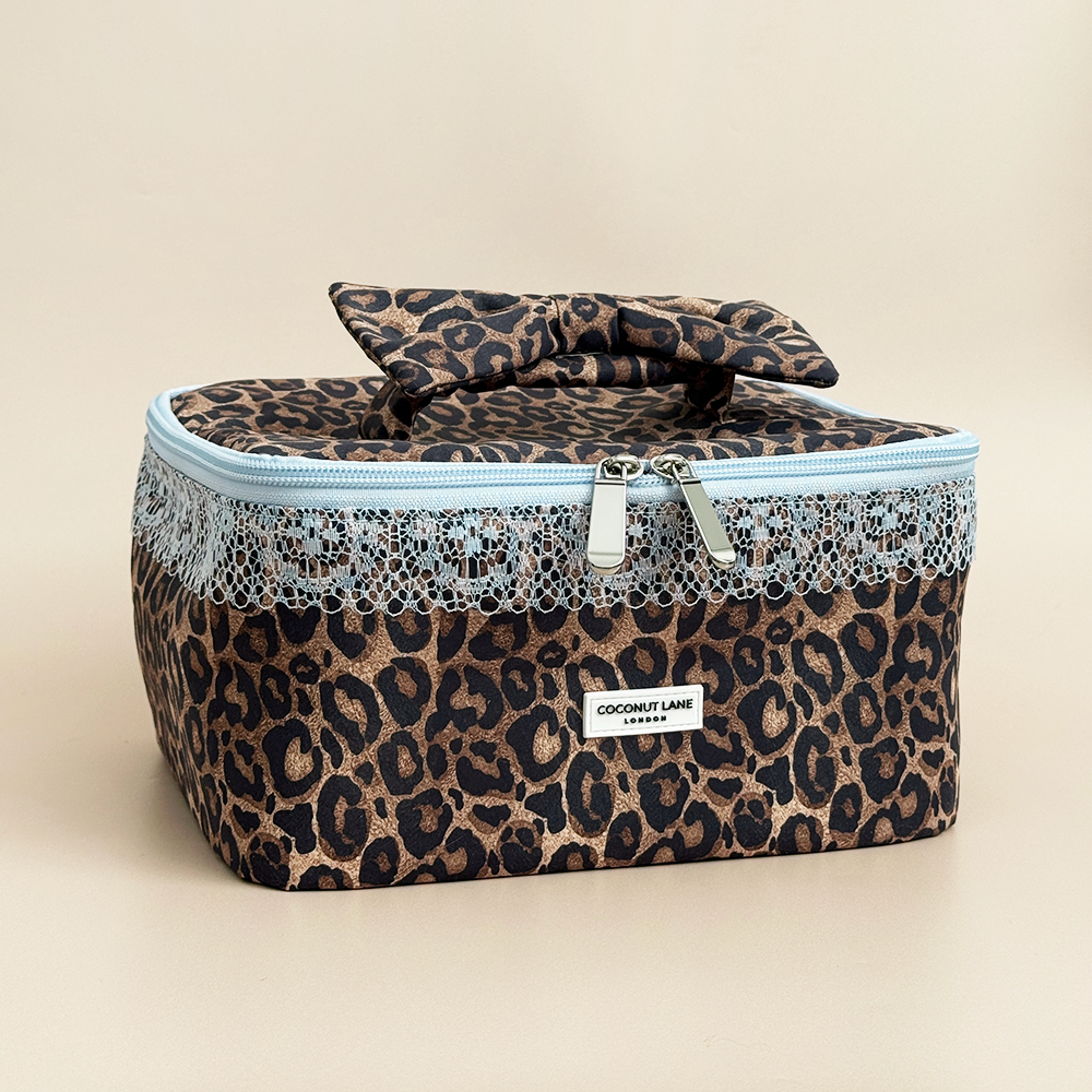 Coconut Lane Leopard Lace vanity case featuring brown leopard print, pale blue lace trim, double zip fastening and matching bow handle.