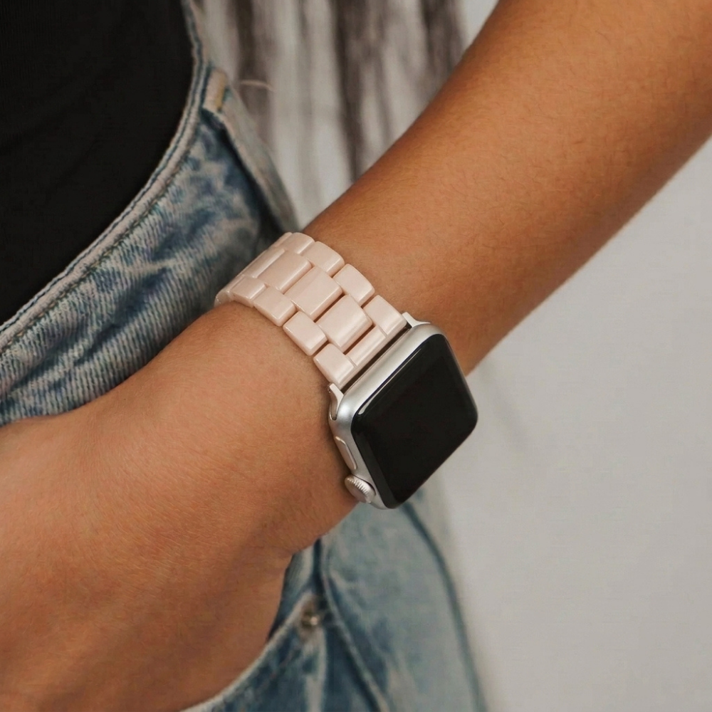 Girl wearing luxe nude watch strap blue jeans and black top