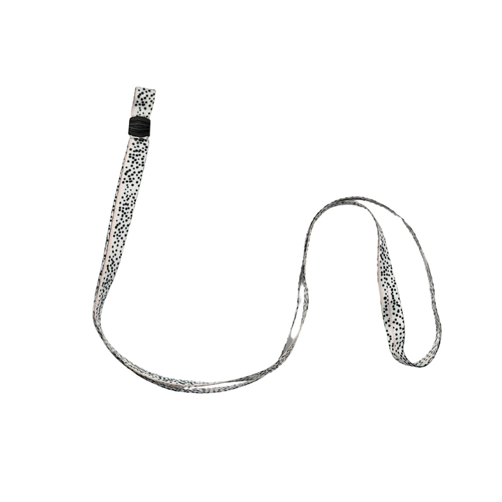A white lanyard with a black polka dot pattern on a plain white background, featuring a plastic clip near the top for attaching items such as keys, ID cards, or even the Coconut Lane Universal Phone Lanyard Patch from the Patch Bundle for enhanced phone security.
