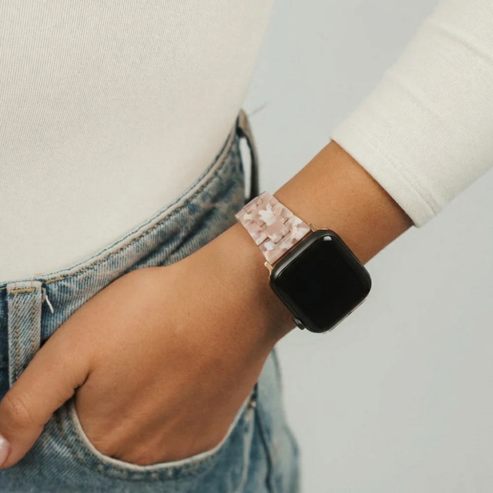 Girl holding up wrist wearing cream long sleeve top showing off Slim Luxe Rose Watch Strap on her wrist