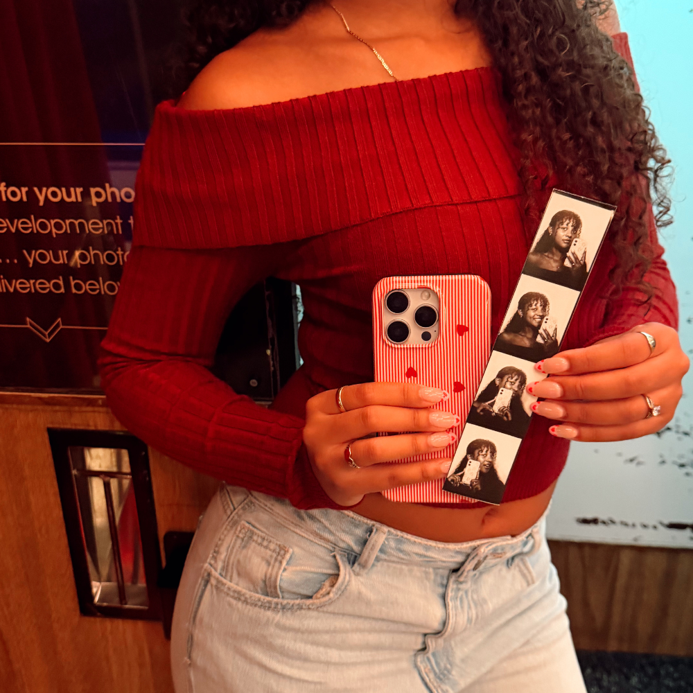 Girl at photobooth with Sweetheart Stripes Phone Case