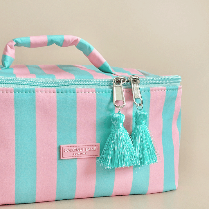 Blue and pink stripe Vanity Case, with tassels and padded handle.