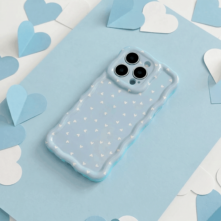 Wavy Phone Case with blue background and white hearts design. 