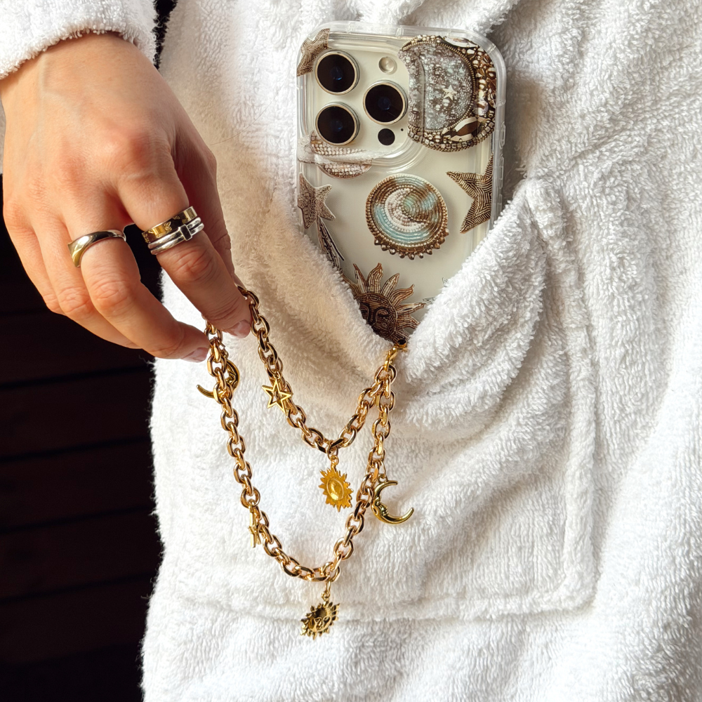 Pastel Celestial Phone Case in pocket with celestial phone strap attached